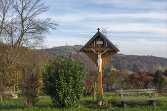 Wayside shrine, Christ on the cross, autumn atmosphere, forest with foliage colouring, near