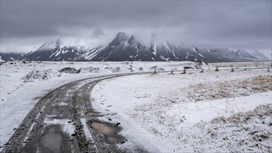 Typical Icelandic snowy nature mountain landscape near Arnarstapi area in Snaefellsnes peninsula in