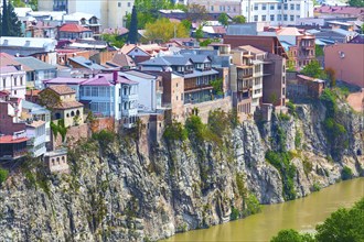 Tbilisi, Georgia, April 29, 2017: Aerial panoramic skyline with old traditional houses over Mtkvari