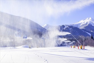 Bansko, Bulgaria, January 28, 2021: Bulgarian winter ski resort panorama with gondola lift cabins,