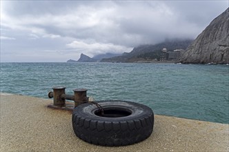 View from the pier from Sudak towards the Novyy Svet, Crimea. Cloudy day, spring, early April