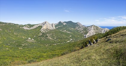 View of the valley from the top of the ridge. Crimea, Tokluk mountain range, sunny day in September