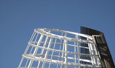 Modern Residential office building construction site and cranes during a vibrant summer day with