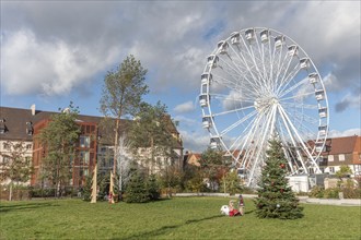 The solar-powered Ferris wheel at the Colmar Christmas market in 2022. Alsace, France, Europe