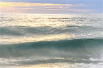 Wave crashing on a sandy beach of the Atlantic Ocean. Sables d'Olonne, Vendee, Pays-de-la-Loire,