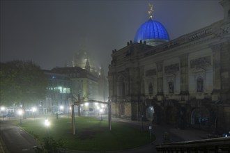 The old town of Dresden shrouded in November fog. Georg Treu Platz with Lipsiusbau, foggy