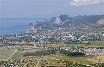 View from the top of Mount Ay-George to the resort town of Sudak. Black Sea coast of Crimea