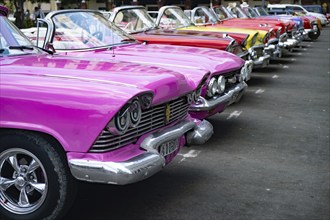 Vintage classic colorful cars parked at Havana city Cuba