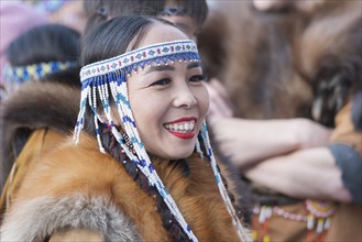 Portrait smiling expression female in traditional clothing aborigine people Kamchatka Peninsula.