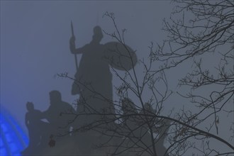 The old town of Dresden shrouded in November fog. Octagon dome with Fama and pediment figures of