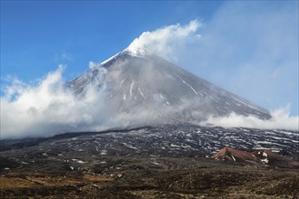 Autumn mountain landscape view of eruption active Klyuchevskoy Volcano (Klyuchevskaya Sopka),