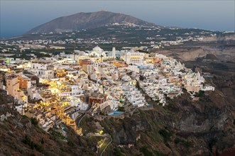 Cityscape of Fira town with white houses and the caldera in Santorini, Greece. Summer holidays,