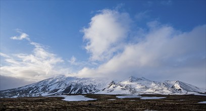 Typical Icelandic landscape with mountains and meadow land covered in snow at snaefellsnes