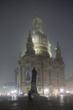 Dresden's old town shrouded in November fog. Church of Our Lady, Foggy atmosphere in Dresden,