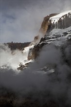 Summit of Kilimanjaro covered with snow and sunlight