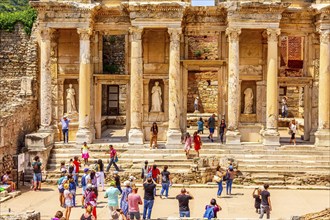 Kusadasi, Turkey, April 28, 2019: People visiting Celsus Library and old ruins of Ephesus or Efes