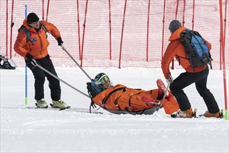 KAMCHATKA PENINSULA, RUSSIA, MAR 28, 2019: Rescuers Kamchatka Rescue Squad on alpine ski evacuate