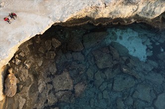 Done scenery of Cape Greko or Cape Greco sea caves Ayia Napa Cyprus. Tourist people doing