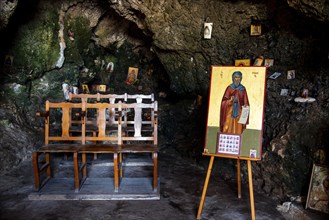 Protaras, Cyprus, August 6 2020: Interior of an old church cave with Christian saint. Ayioi Saranta