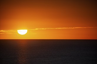 Texture of romantic setting sun with red sky