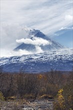 Volcanic landscape of Kamchatka: active Klyuchevskaya Sopka, view of volcanic eruption, plume of