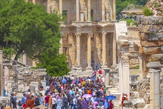 Kusadasi, Turkey, April 28, 2019: People visiting Celsus Library and old ruins of Ephesus or Efes