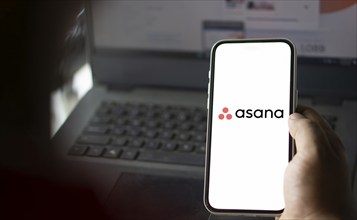 Dhaka, Bangladesh- 09 Nov 2024: Asana logo is displayed on smartphone