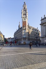 Lille, France, September 1, 2018: High clock tower on the Theater Square (Place du Theatre) in