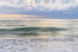 Wave crashing on a sandy beach of the Atlantic Ocean. Sables d'Olonne, Vendee, Pays-de-la-Loire,