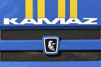 KAMCHATKA, RUSSIA, OCT 2, 2018: Badge and logotype of truck KAMAZ and sticker orange-blue stripes