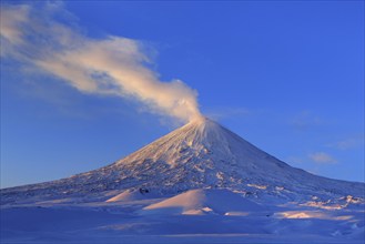 Beautiful winter volcanic landscape of Kamchatka Peninsula: view of eruption active Klyuchevskoy