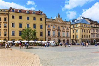 Krakow, Poland, June 18, 2019: Panorama of main market square Rynek Glowny with houses and horse