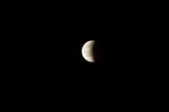 Full moon with shadow is eclipsed and only half of the moon is visible