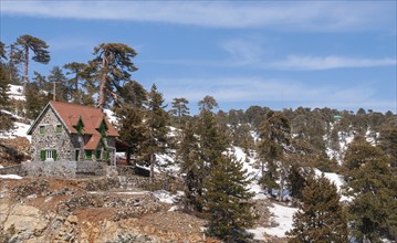 Idyllic mountain chalet and landscape Troodos mountains in Cyprus during winter