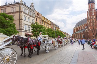 Krakow, Poland, June 18, 2019: Horse carriage close-up at the main market square Rynek Glowny,