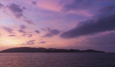 Violet sunset over the sea in the marine reserve. Malaysia