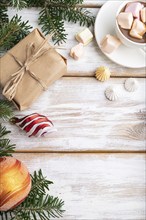 Christmas or New Year frame composition. Decorations, box, balls, cinnamon, ribbons, fir and spruce