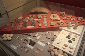 Pottery and tool display of neolithic finds, National Museum of Archaeology, Valletta, Malta,