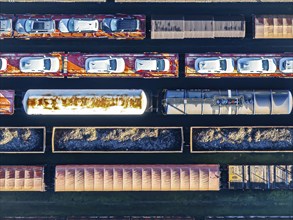 Deutsche Bahn AG marshalling yard. Many goods trains are parked on the tracks with tank wagons, car