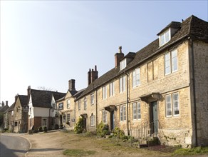 Historic houses and The George Inn at the village of Lacock, Wiltshire, England, UK