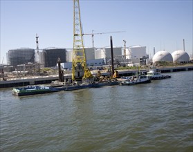 Dredger operating to deepen the river channel, River Maas, Port of Rotterdam, Netherlands