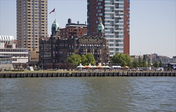 Historic Hotel New York building dwarfed by modern skyscrapers, Rotterdam, Netherlands