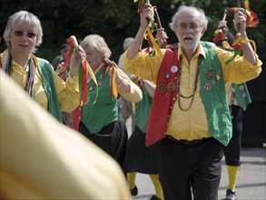 Male and female traditional Morris dancers perform at rural folk event, Shottisham, Suffolk,