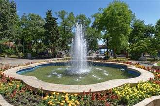 Fountain surrounded by flowerbeds in the municipal park of Sozopol. Bulgaria, South-East Europe