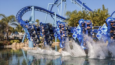 Manta roller coaster behind water splashes in lagoon at Sea World in Orlando, Florida, USA, North