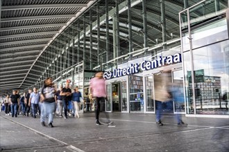 Station forecourt of Utrecht Centraal station, people on their way to, from the station,