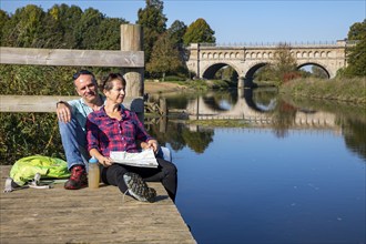 Hikers in the Steverauen Olfen, Alte Fahrt canal bridge, of the Dortmund-Ems Canal, a renaturalised