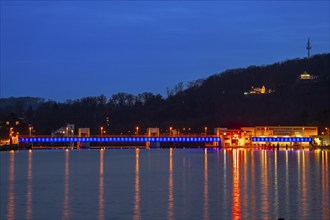 Lake Baldeney, illuminated weir, with lock, left and hydroelectric power plant power station,