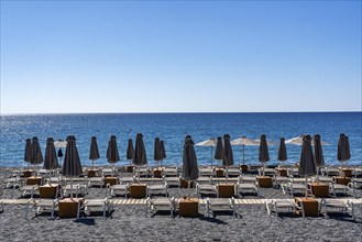 Beach, empty, organised, with sun loungers and parasols, catering, bay at Koutsounari Beach, on the