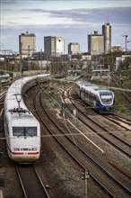 Train on the tracks west of Essen central station, skyline of the city centre, ICE train, North